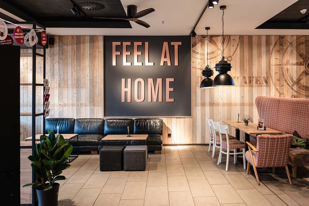 Feel at Home-muur in een Coffee Fellows vestiging